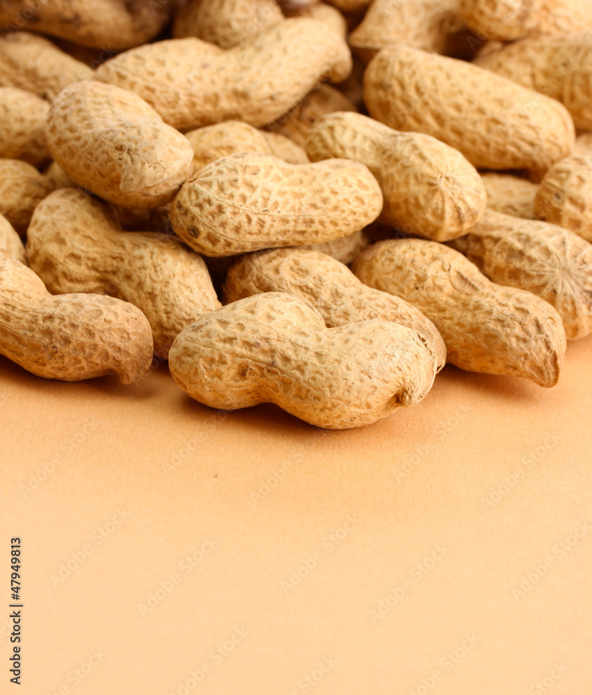 tasty peanuts, on beige background tasty peanuts, on beige background