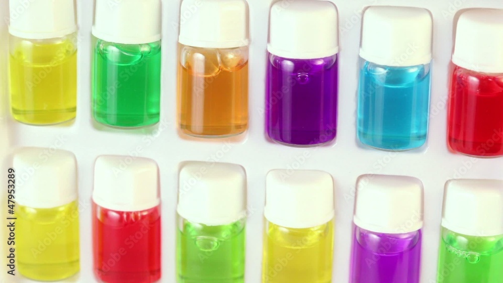 box rotates with set of color oil in small bottles box rotates with set of color oil in small bottles