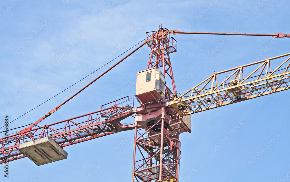 A red and yellow construction hoisting crane A red and yellow construction hoisting crane