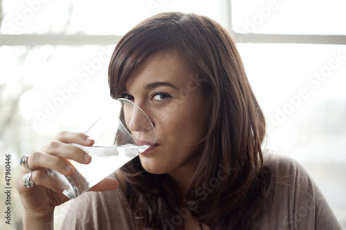 Fototapeta Naklejka Na Ścianę i Meble -  Young Woman Drinking Water