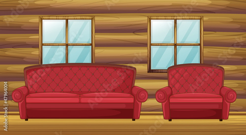 Red sofa and chair in wooden room