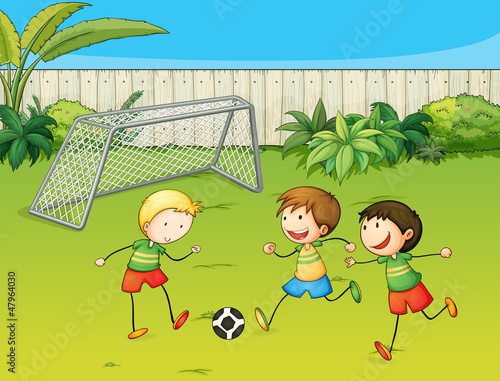 Kids playing football on football ground