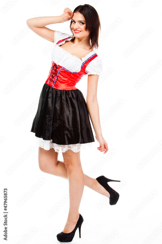 young and beautiful woman in a traditional Bavarian dress young and beautiful woman in a traditional Bavarian dress