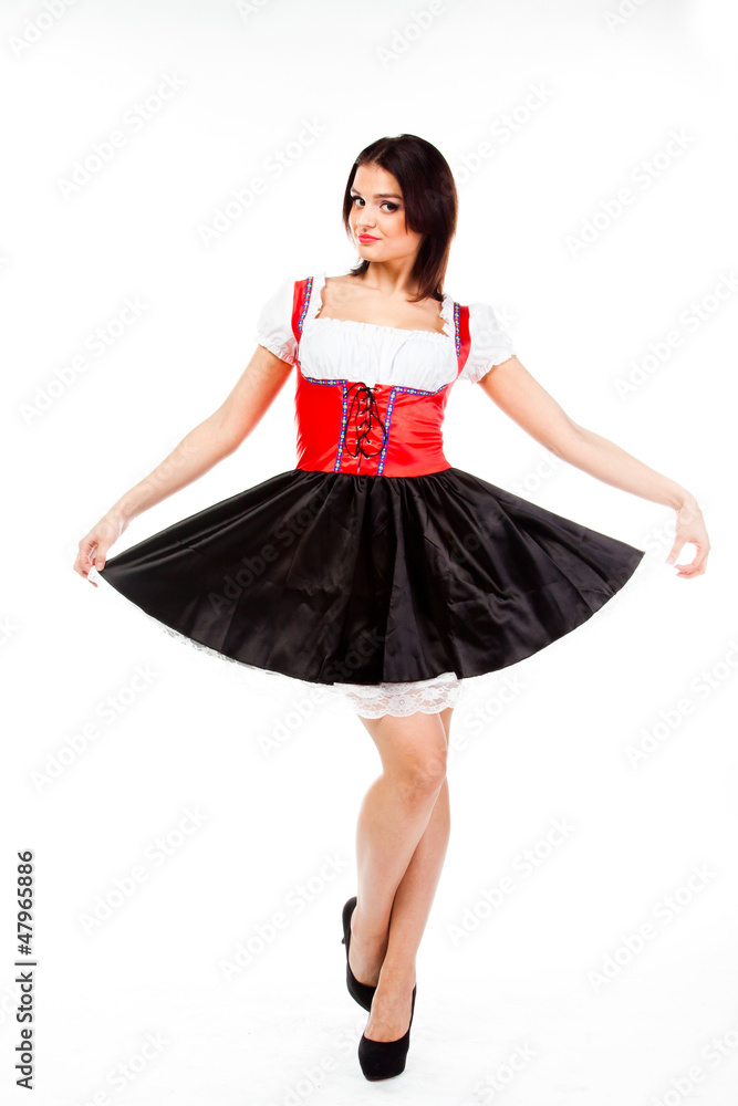 young and beautiful woman in a traditional Bavarian dress young and beautiful woman in a traditional Bavarian dress