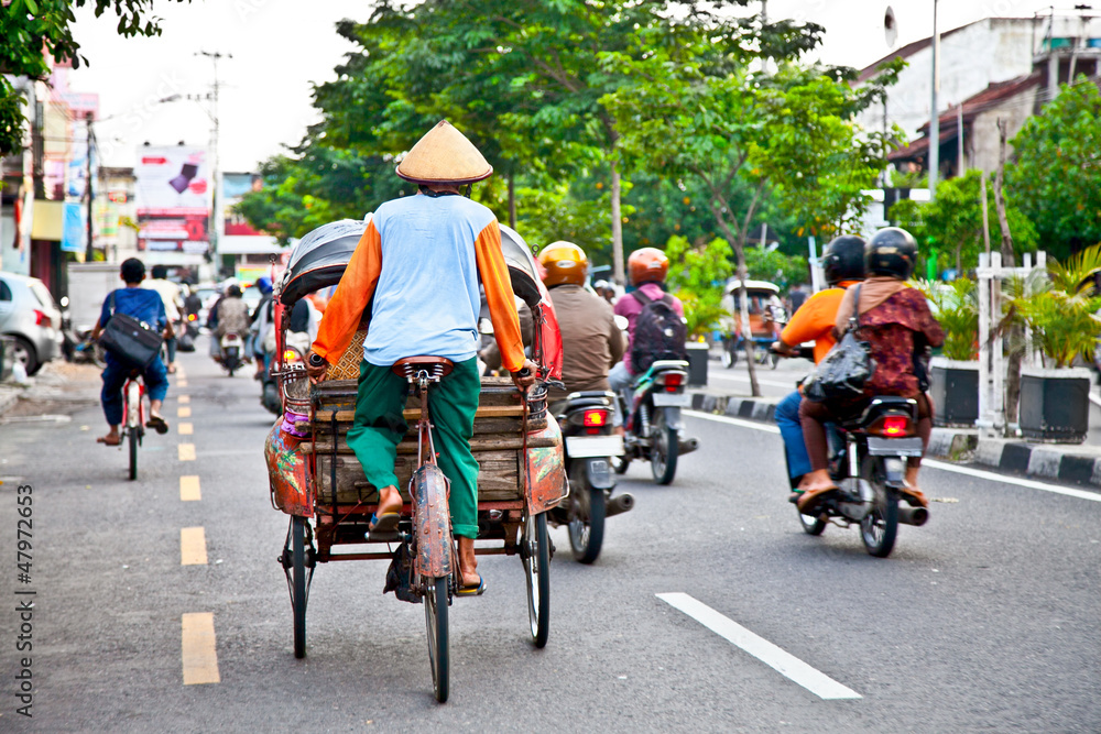 View of Yogyakarta with its typical hundreds of motorbikes on th - obrazy, fototapety, plakaty 