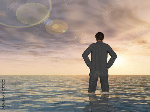 Fotografie Conceptual Young businessman standing in water