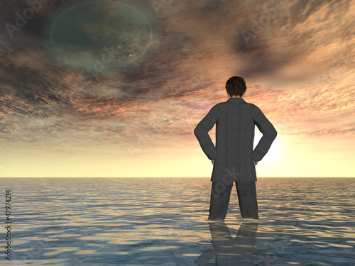 Fotografie Conceptual Young businessman standing in water
