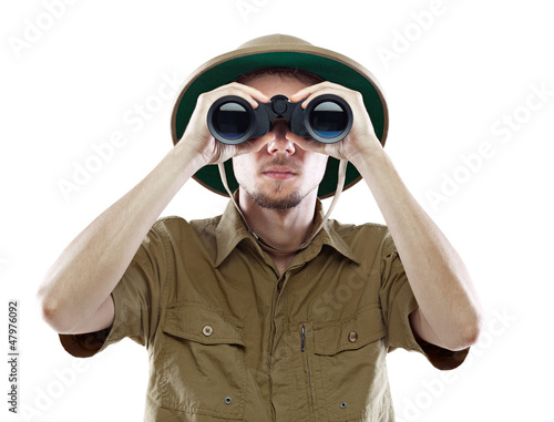 Explorer looking through binoculars