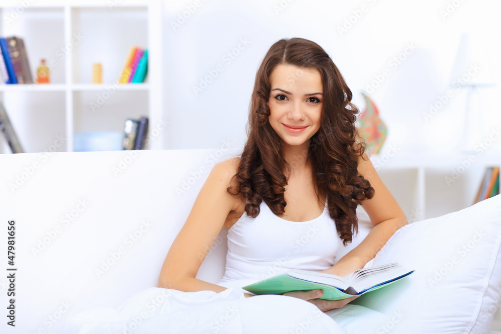 Young woman at home with a book Young woman at home with a book