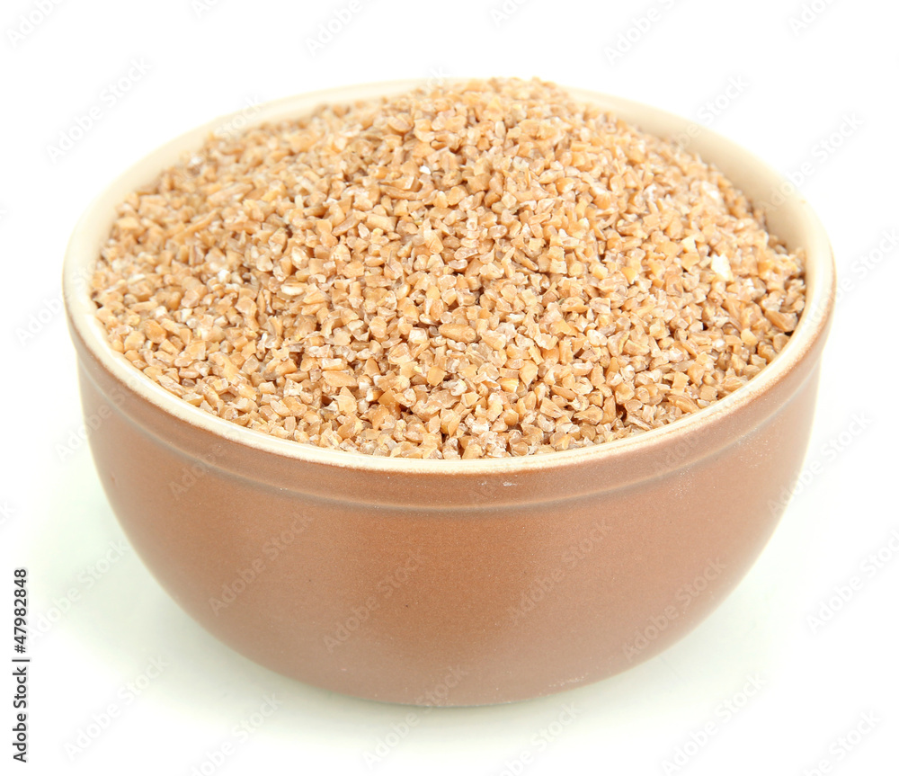 Brown bowl full of wheat bran isolated on white Brown bowl full of wheat bran isolated on white