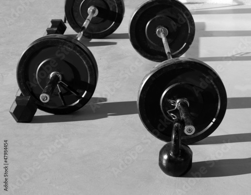 Kettlebells at crossfit gym with lifting bar weights