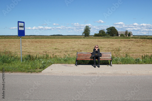 lonely woman in bus stop