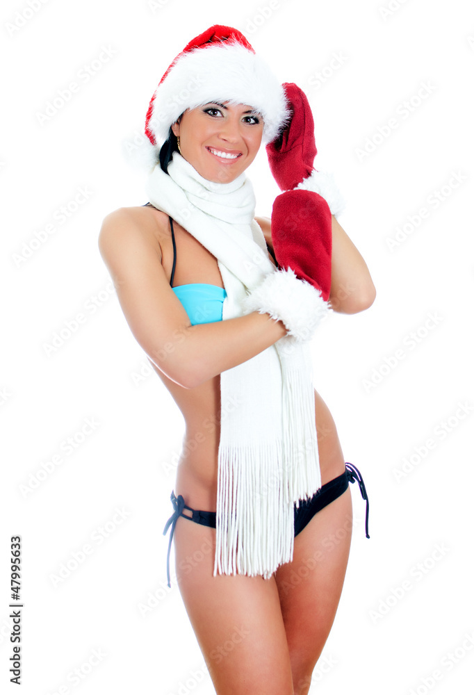 Young sexy woman wearing bikini and christmas hat and gloves Young sexy woman wearing bikini and christmas hat and gloves