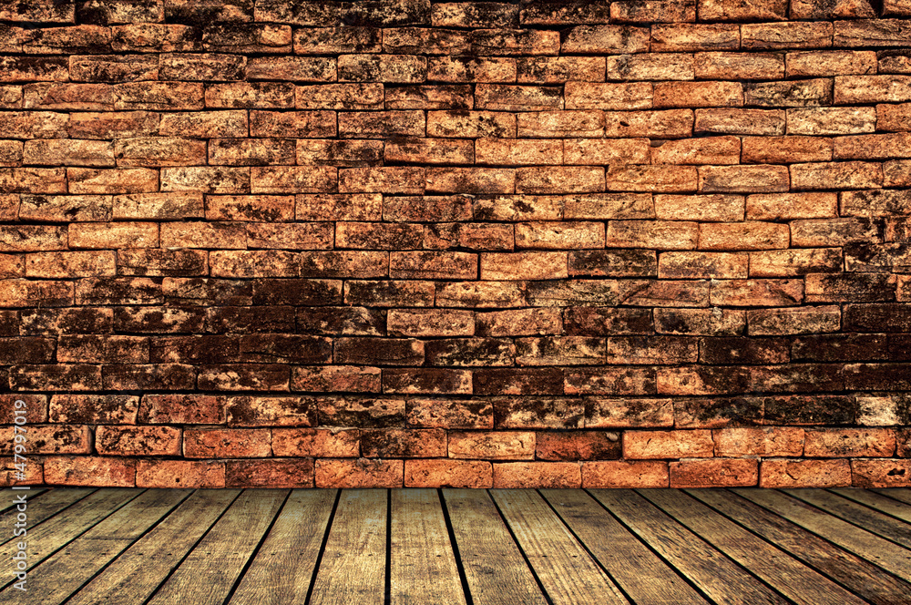 Brick wall with wooden walk way
