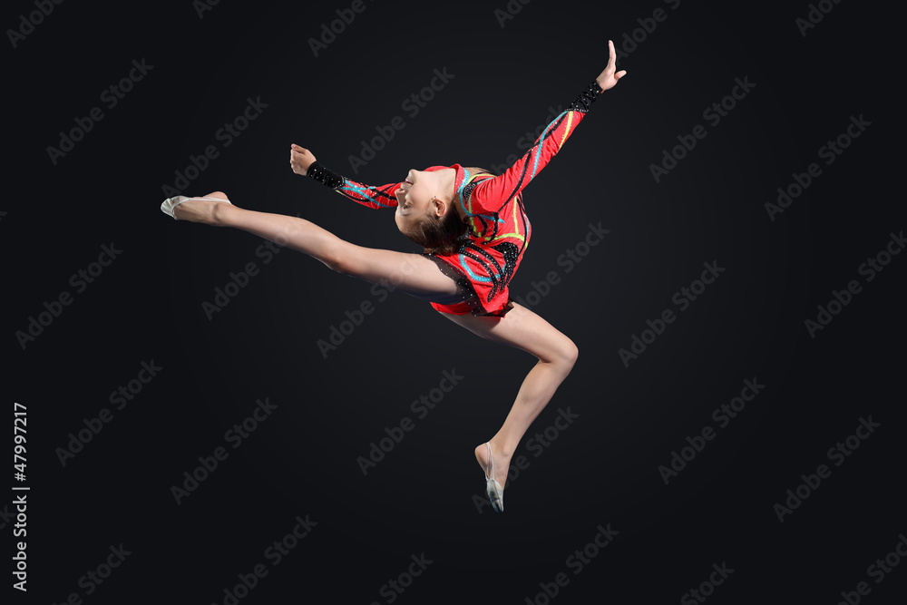 Young woman in gymnast suit posing