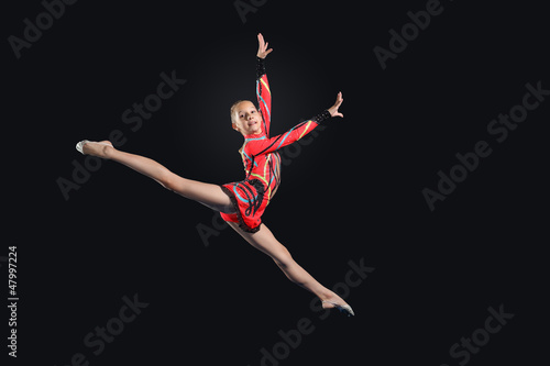 Young woman in gymnast suit posing © Sergey Nivens