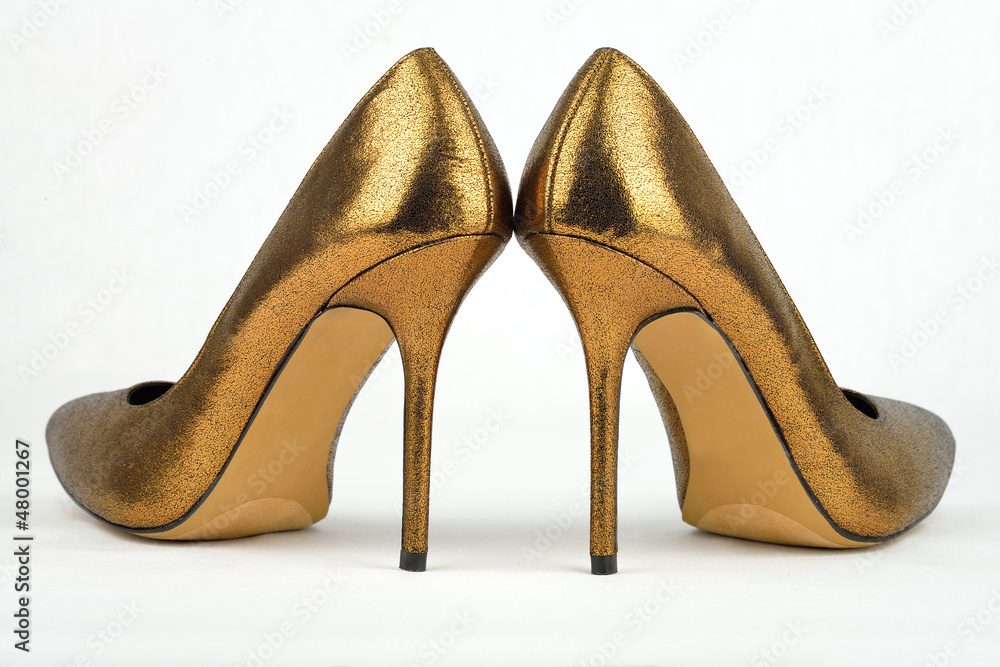 Pair of golden colored High Heel Pair of golden colored High Heel