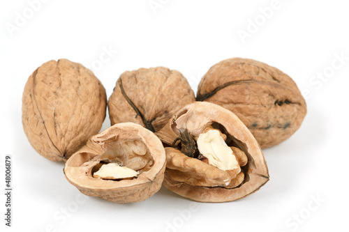walnut and a cracked walnut isolated on white background