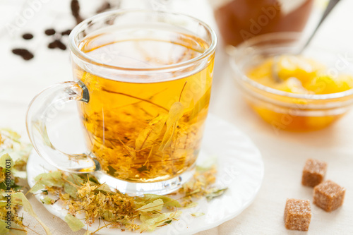 Transparent cup golden linden tea