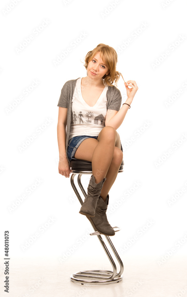 Pretty blonde woman on a bar stool