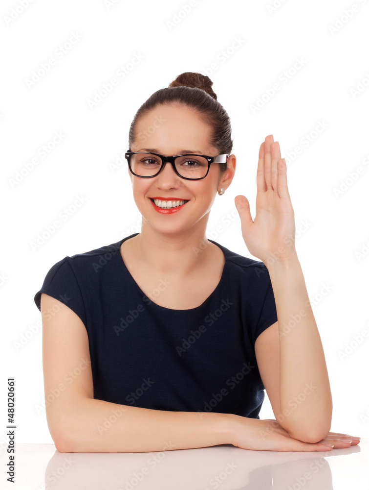 Portrait of business woman sitting on her desk Portrait of business woman sitting on her desk