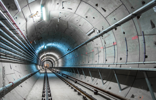 Underground tunnel with blue lights photo