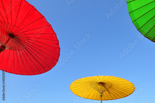 Traditional Thai umbrella with blue sky background