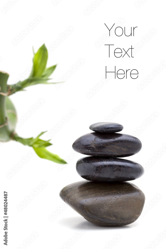 Zen pebble stones with bamboo plant Zen pebble stones with bamboo plant