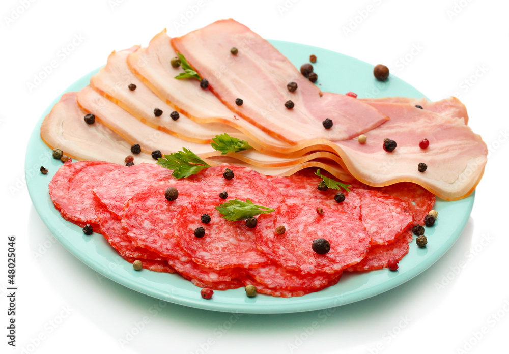 tasty bacon and sausage with spices on plate, isolated on white tasty bacon and sausage with spices on plate, isolated on white