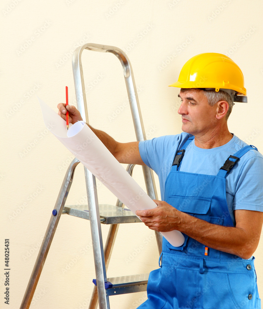 Architect studying construction project Architect studying construction project