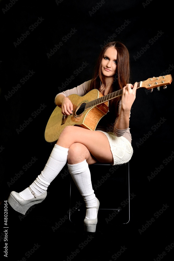 Fototapeta premium Young girl with guitar.