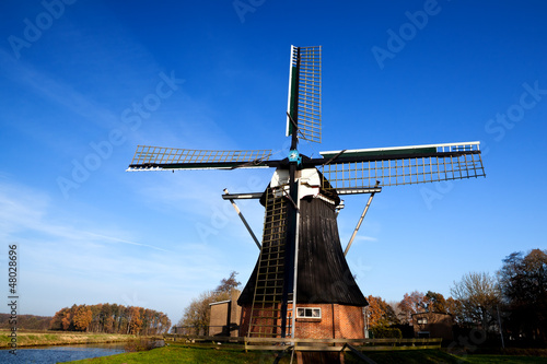 Dutch windmill over blue sky