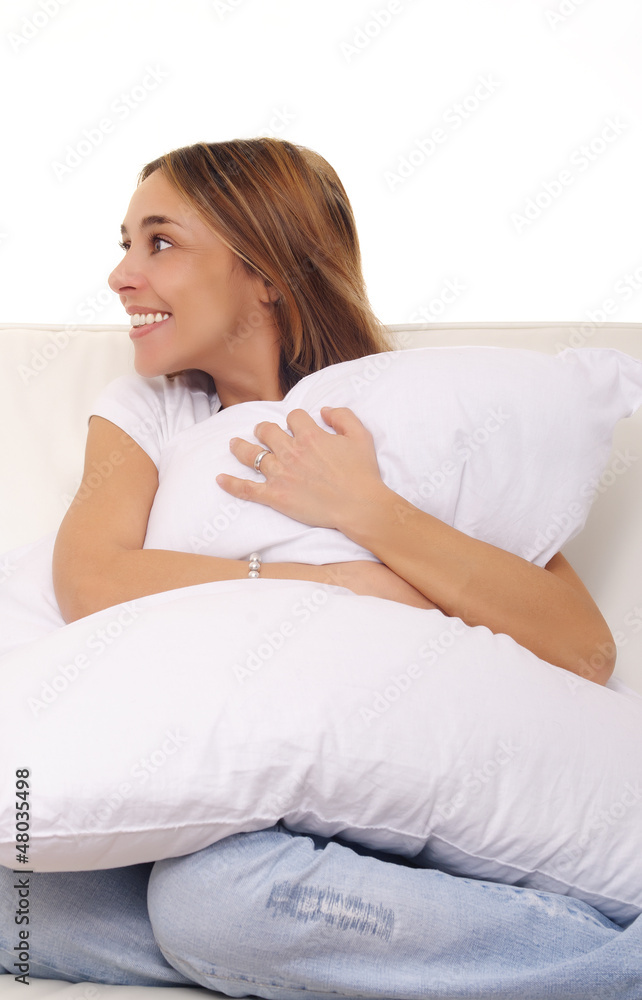 mature lady cuddling a pillow on couch mature lady cuddling a pillow on couch