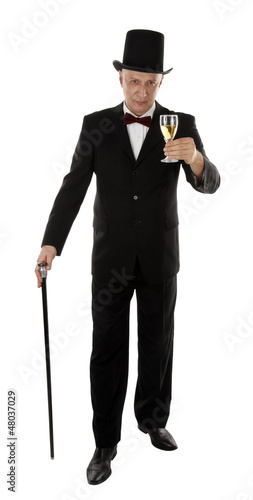 Rich man is holding glass and toasting