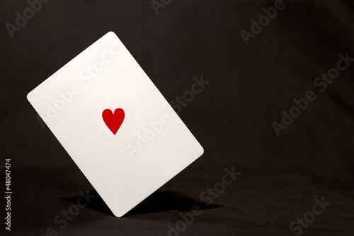 Balanced white card with heart symbol