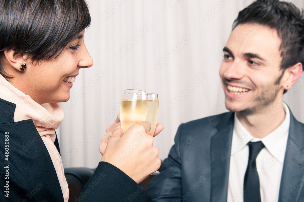 Young couple celebrating with champagne. Young couple celebrating with champagne.