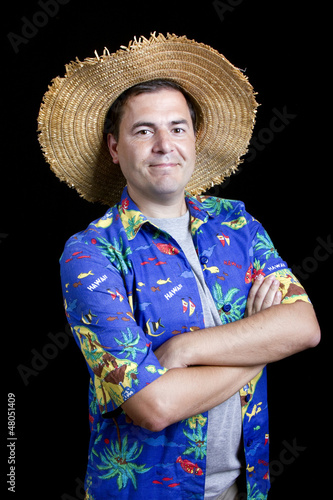 young silly man traveler portrait on black background