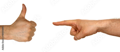 Hand pointing to a hand showing thumb up