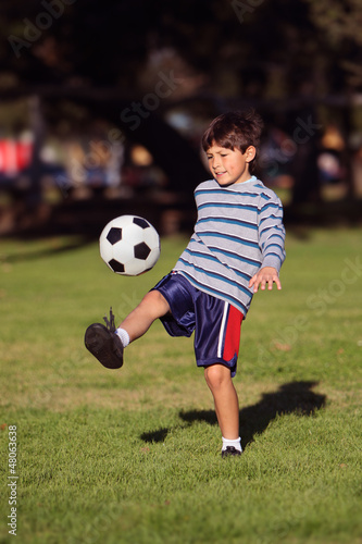 Young boy with soccer ball in park © Nicholas B