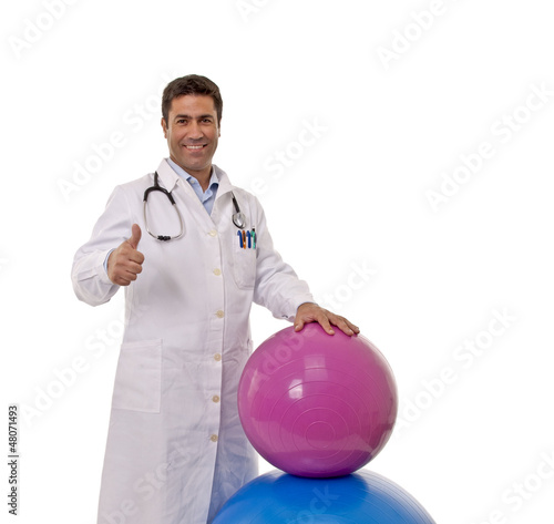 Portrait of happy doctor with a Pilates ball.