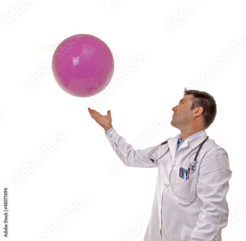 Portrait of happy doctor with a Pilates ball.