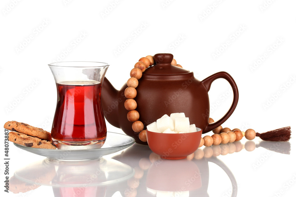 Fototapeta premium glass of Turkish tea and kettle isolated on white