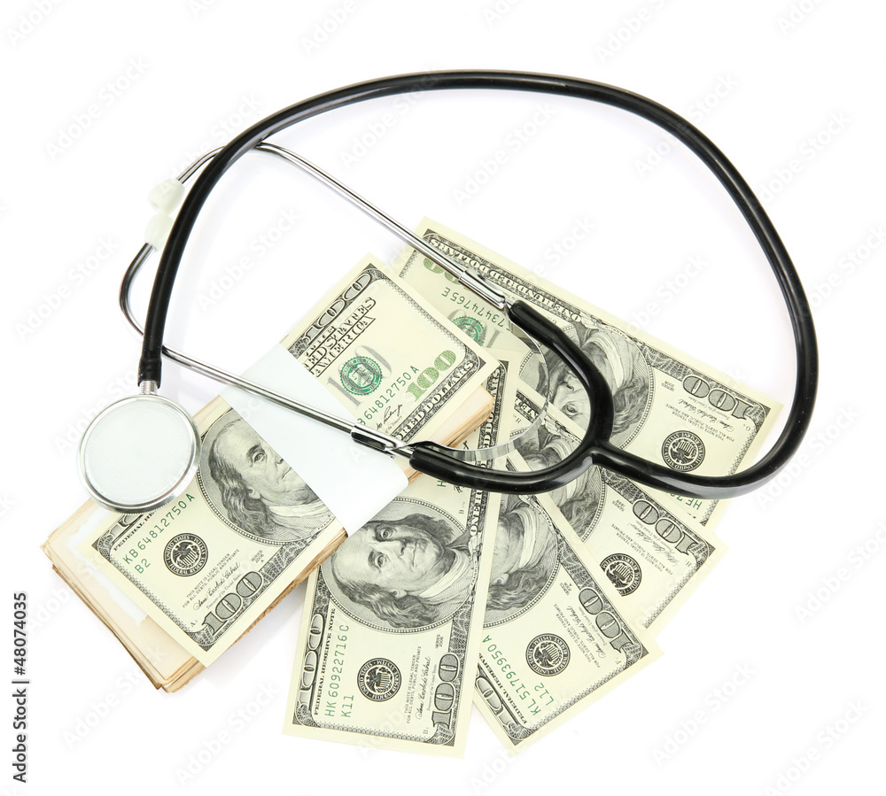 Healthcare cost concept: stethoscope and dollars isolated Healthcare cost concept: stethoscope and dollars isolated