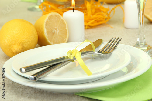 beautiful holiday table setting with lemons, close up