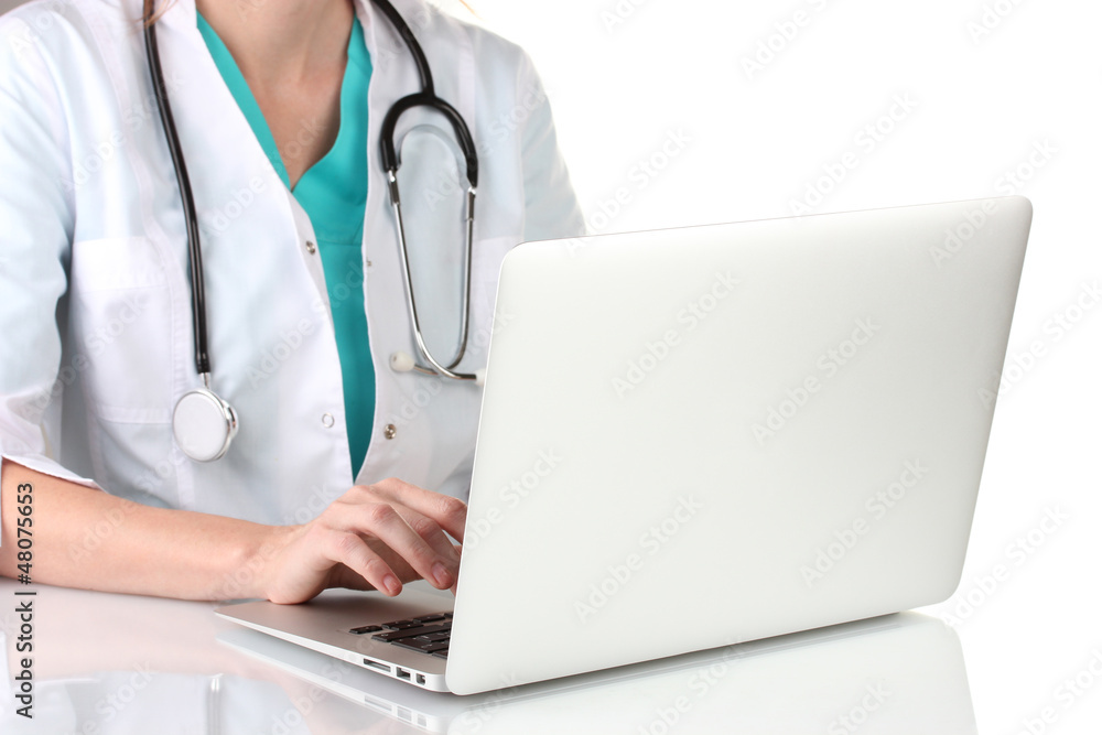 Doctor using laptop computer isolated on white