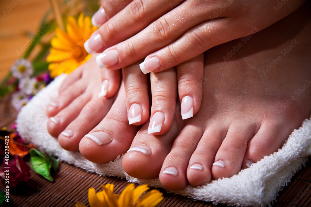 Fototapeta premium Woman's french manicure and pedicure