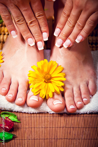 Woman's french manicure and pedicure 