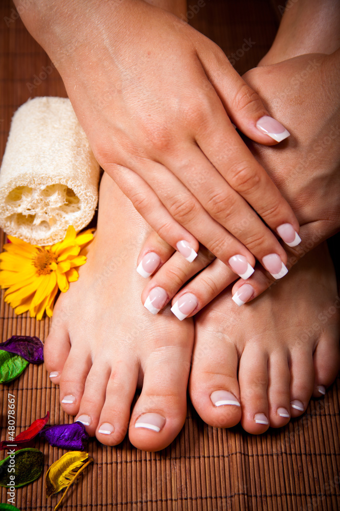 Fototapeta premium Woman's french manicure and pedicure 