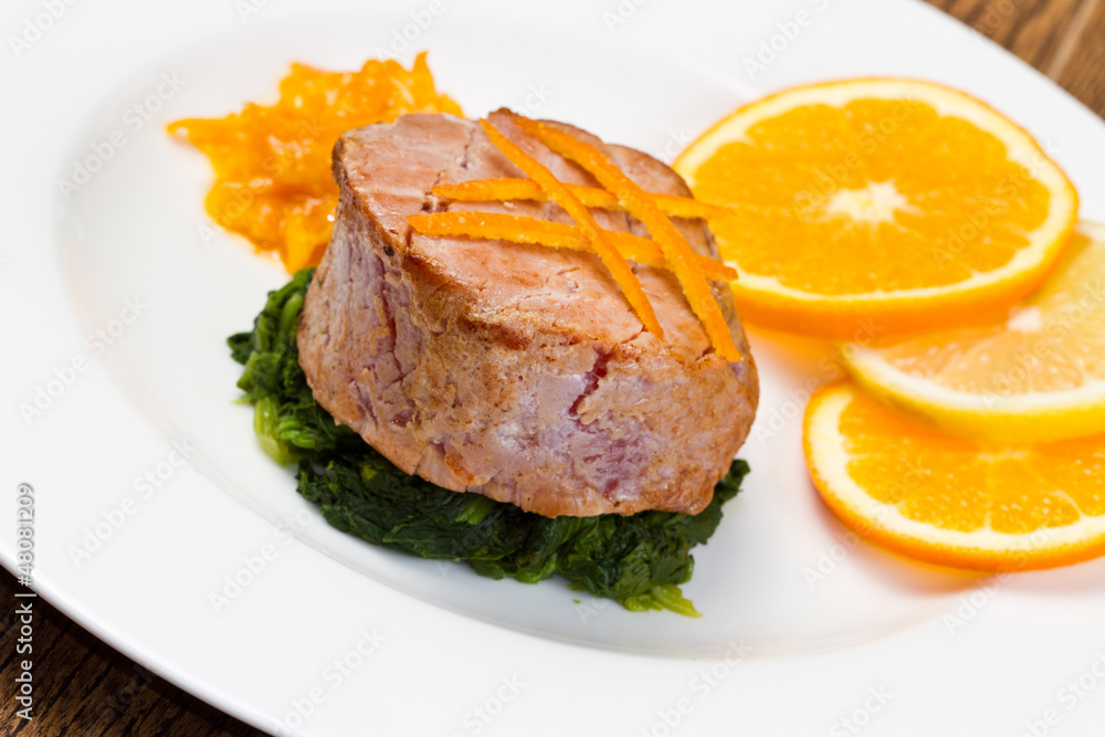 fried tuna fillet with fresh orange ,orange sauce and spinach fried tuna fillet with fresh orange ,orange sauce and spinach