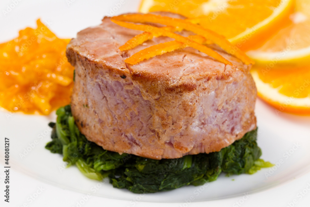 fried tuna fillet with fresh orange ,orange sauce and spinach